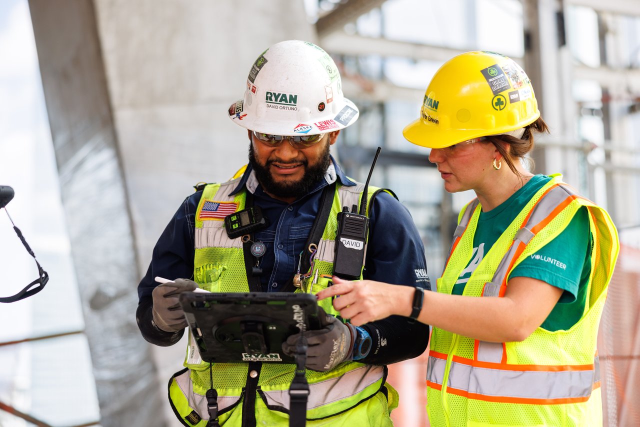 Man holding tablet at construction site